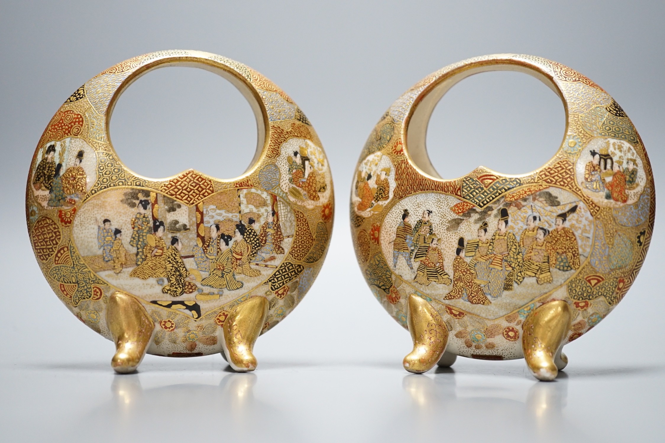 A pair of Japanese Satsuma crescent vases on quad footed base, signed to base, 11.5cm tall